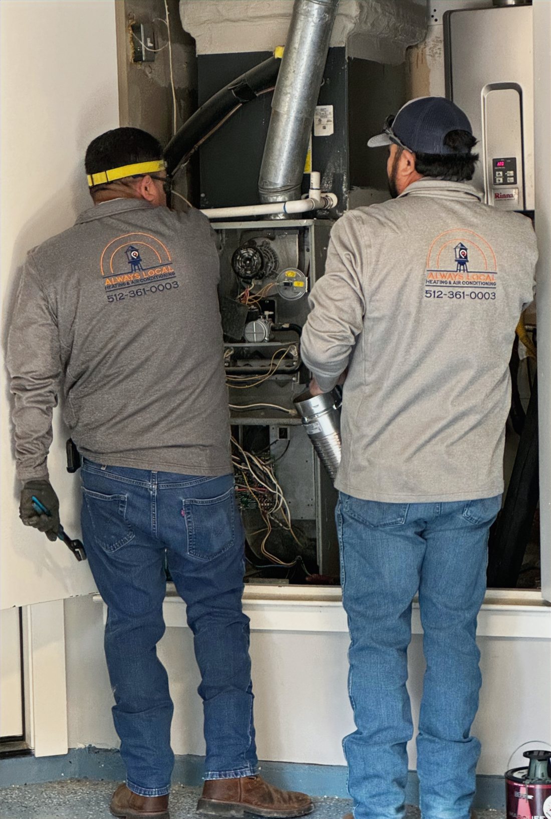 Always Local technicians servicing a residential furnace