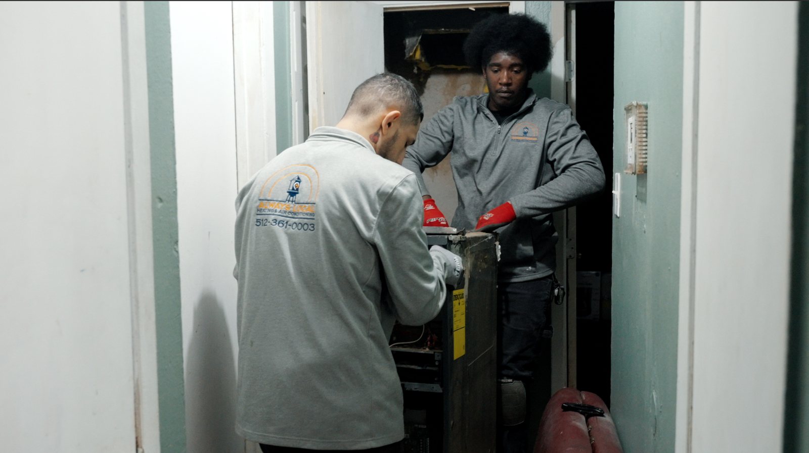 Always Local technicians working on an indoor air handler